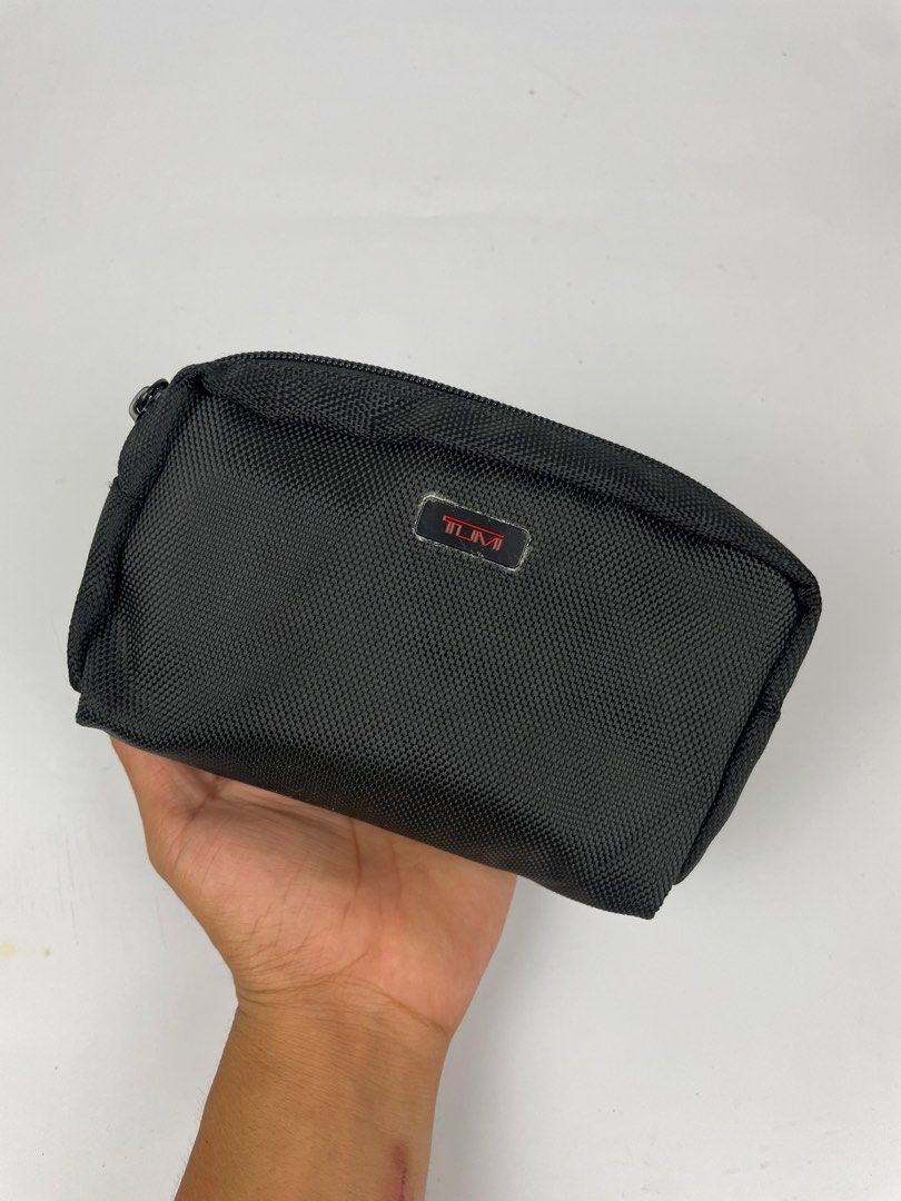 Tumi for Delta Black Nylon Travel Pouch (Category: Luxury Bags & Wallets) located in Manila. Submitted by rdtp2 (Listing ID 1444292959, Image 1). Description: - Black Tumi Pouch - Delta Collaboration - Durable Nylon Material - Zipper Closure - Ideal for Travel Essentials or Toiletries - Compact Size - Clean Interior.