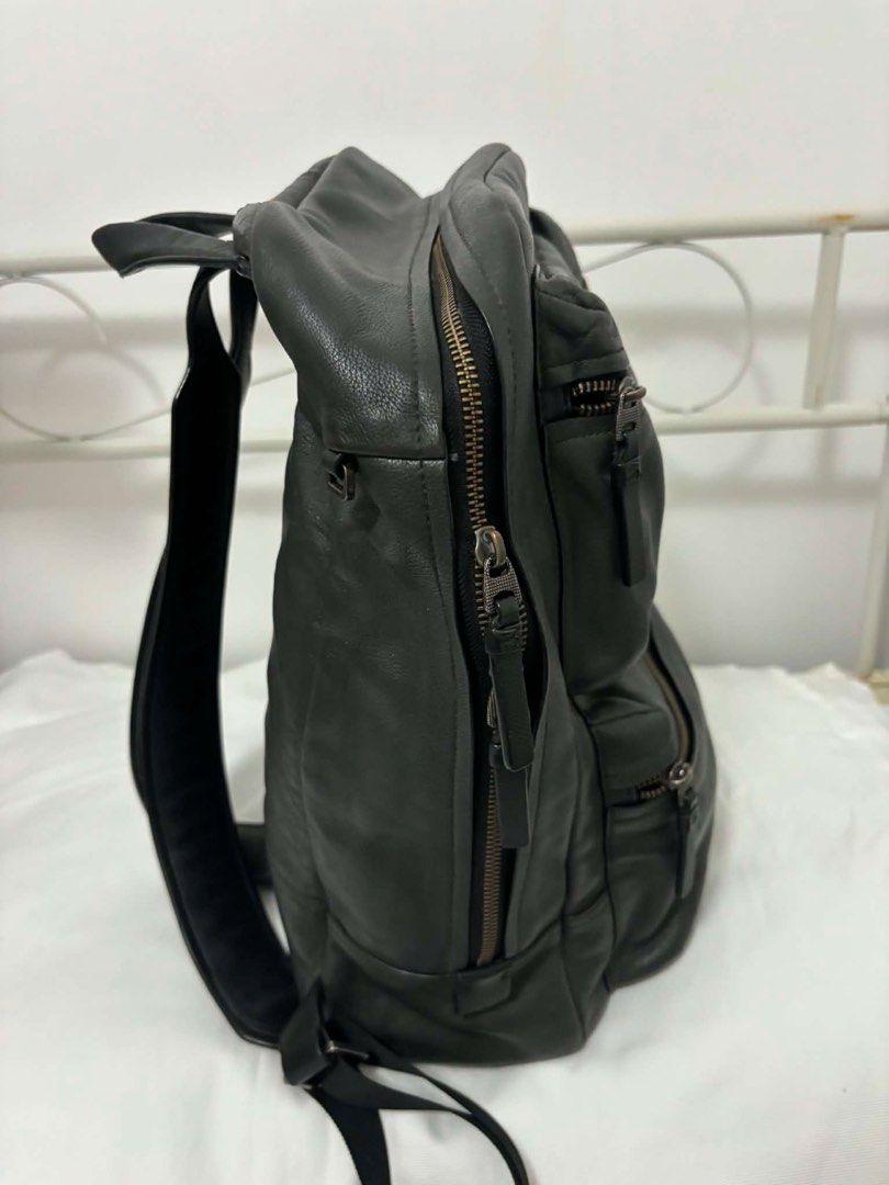 Tumi Mission Bryant laptop backpack (Category: Backpacks) located in Taguig. Submitted by maygm72703 (Listing ID 1444296386, Image 3). Description: Approximately 32 x 47 x 17 cm (roughly 12.6” L x 18.5” H x 6.7” W). Capacity: Often categorized as a medium to large-capacity bag, typically designed to fit a 15-inch laptop. Key Features:Material: High-quality black or iron gray leather. Compartments: One main zippered compartment, two prominent fron