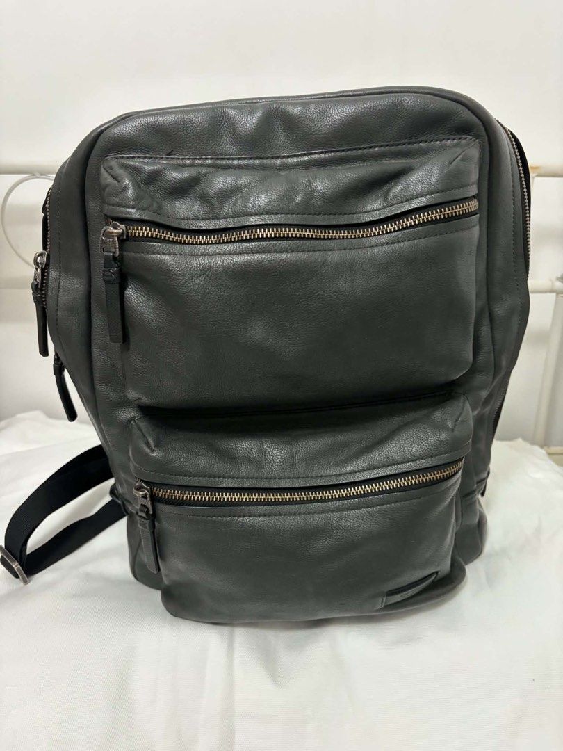 Tumi Mission Bryant laptop backpack (Category: Backpacks) located in Taguig. Submitted by maygm72703 (Listing ID 1444296386, Image 1). Description: Approximately 32 x 47 x 17 cm (roughly 12.6” L x 18.5” H x 6.7” W). Capacity: Often categorized as a medium to large-capacity bag, typically designed to fit a 15-inch laptop. Key Features:Material: High-quality black or iron gray leather. Compartments: One main zippered compartment, two prominent fron