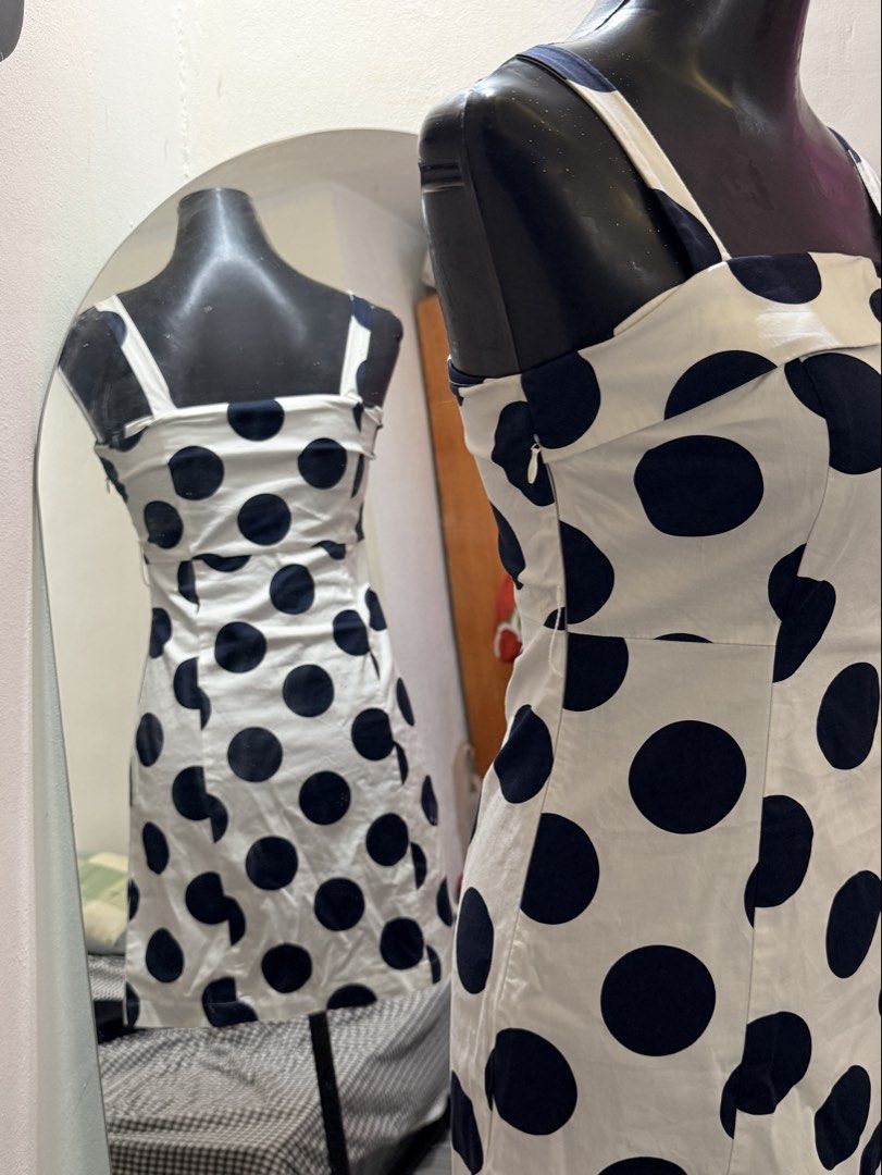 White and Black Polka Dot Mini Dress (Category: Dresses) located in Caloocan City. Submitted by prettyplease000 (Listing ID 1444280064, Image 2). Description: FOR XS TO SMALL FRAME ONLY this is like new, no issue mini dress -Cute white dress with big black polka dots - Square neckline with folded detail - Spaghetti straps - Side zipper closure - Short length.