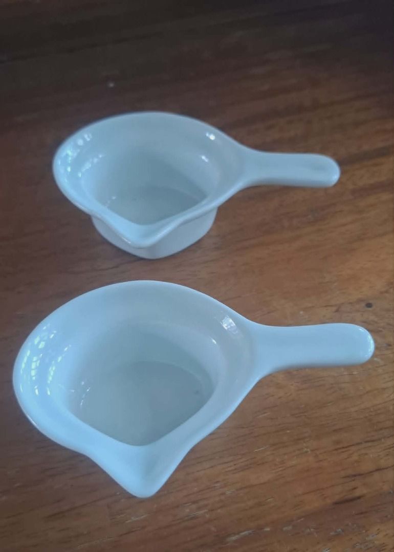 White Ceramic Spoon Rest / Condiment Dish Set (2 pcs) (Category: Cookware & Accessories) located in Quezon City. Submitted by m_decluttering_sale (Listing ID 1444160765, Image 2). Description: White Ceramic Spoon Rest / Condiment Dish Set (2 pcs) 💯 Pre-owned, Like New Elegant white ceramic dishes in excellent condition. Can be used as spoon rests, condiment dishes, dipping sauce bowls, or for serving small portions of spices and seasonings. Clea