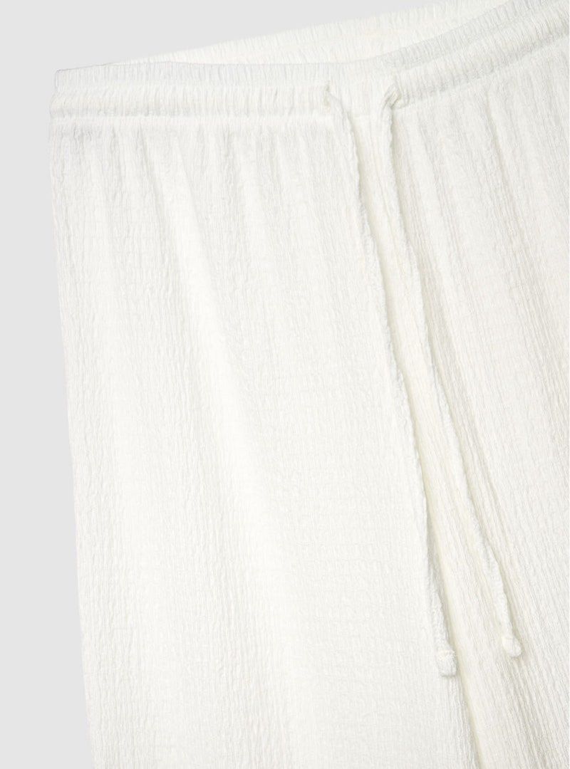 White Linen Blend Wide Leg Pants (Category: Other Bottoms) located in Quezon City. Submitted by clothes.sellllll (Listing ID 1442791307, Image 3). Description: SIZE: 40-43 waist, 40 inch length - NEVER WORN - Comfy white wide-leg pants - Feels like a linen blend - Elastic waistband with drawstring - Features side pockets - Ideal for lounging and casual wear.