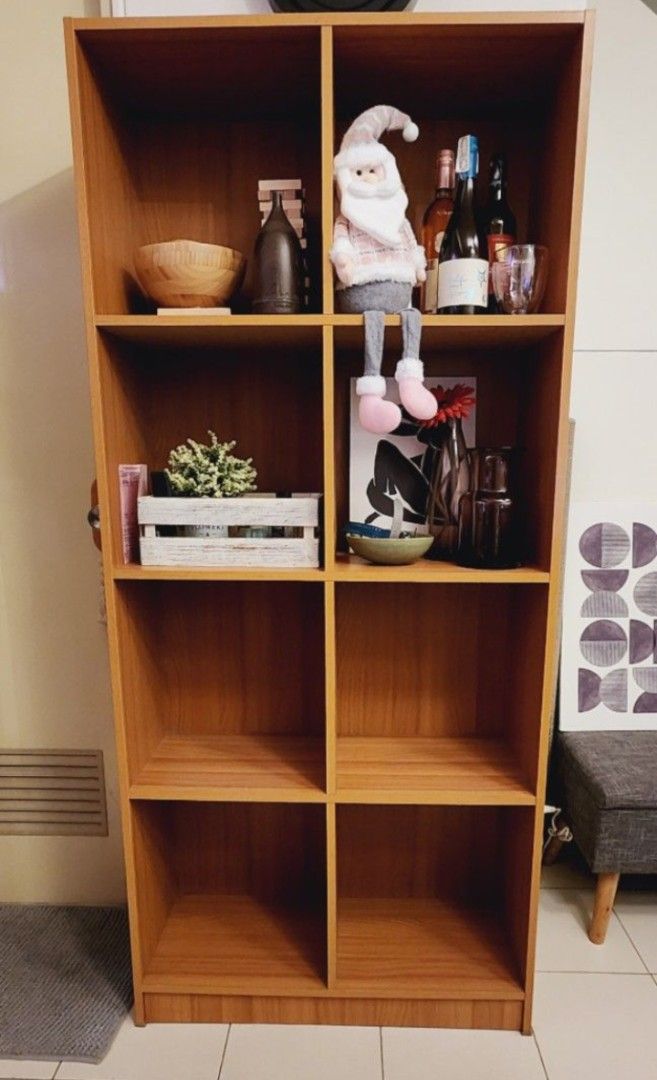 Wooden Bookshelf (Nego!) (Category: Shelves, Cabinets & Racks) located in Quezon City. Submitted by bubbles023 (Listing ID 1444301772, Image 1). Description: Wooden Bookshelf in color maple total width: 76cm (31 inches) total height: 175cm (69 inches) shelf size: depth 30cm x width 37cm (12 in x 14.5 in) in good condition, no issues !! NOTE: CANNOT BE DISASSEMBLED, contents not included!! RFS: decluttering open to offers BUYER WILL HANDLE PICK UP