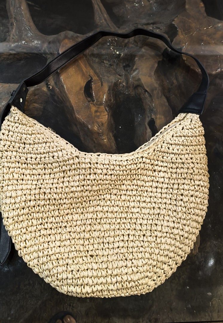 Woven Straw Shoulder Bag with Black Leather Strap (Category: Shoulder Bags) located in Cagayan de Oro. Submitted by tommygurl1218 (Listing ID 1444120623, Image 1). Description: - Cute woven straw shoulder bag - Natural straw color with black leather strap - Ideal for summer outings and beach days - Spacious enough for essentials - Durable, tight weave - Simple and chic design.