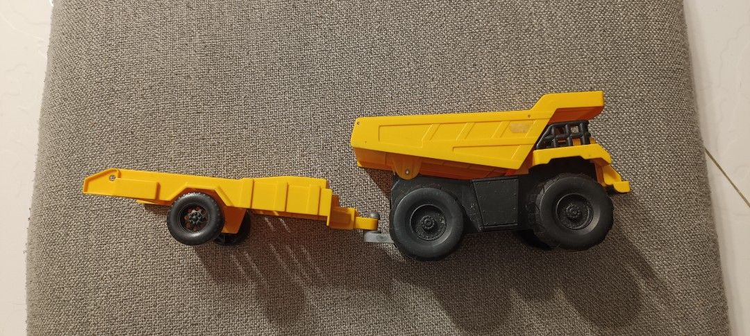 Yellow Dump Truck with Trailer Toy (Category: Kids Toys) located in Manila. Submitted by deeclutter_hub (Listing ID 1444225690, Image 2). Description: - Yellow dump truck toy - Detachable flatbed trailer - Truck bed lifts up - Made of durable plastic - Ideal for imaginative construction play - Great for kids who love construction vehicles.