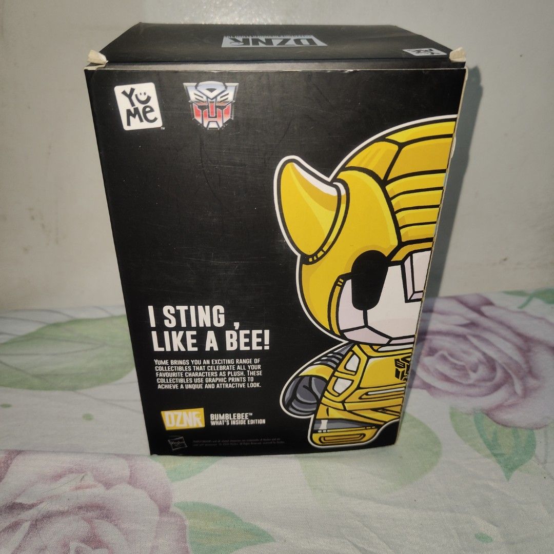 YuMe Transformers DZNR Bumblebee What's Inside Edition Plush (Category: Plushies & Soft Toys) located in Quezon City. Submitted by patric1218 (Listing ID 1444275769, Image 3). Description: - YuMe DZNR Transformers Bumblebee Plush - 'What's Inside Edition', Number 02 - Unique split design: shows both robot and car modes - Comes in original packaging - Ideal for any Transformers collector or fan.