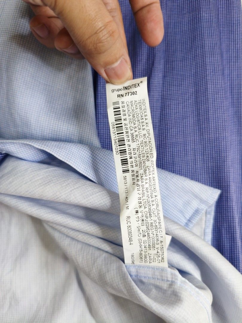 Zara Man Asymmetric Color-Block Houndstooth Button-Down Shirt (Category: Formal Shirts) located in Bontoc. Submitted by rad.bunny (Listing ID 1444228420, Image 3). Description: Authentic ZARA Man long-sleeve collared shirt featuring a unique, eye-catching asymmetric color-block design. Made with a premium mini-houndstooth (pata de gallo) pattern weave in alternating panels of deep navy blue and soft sky blue. ✨ Details: • Brand: Zara Man • Size: 