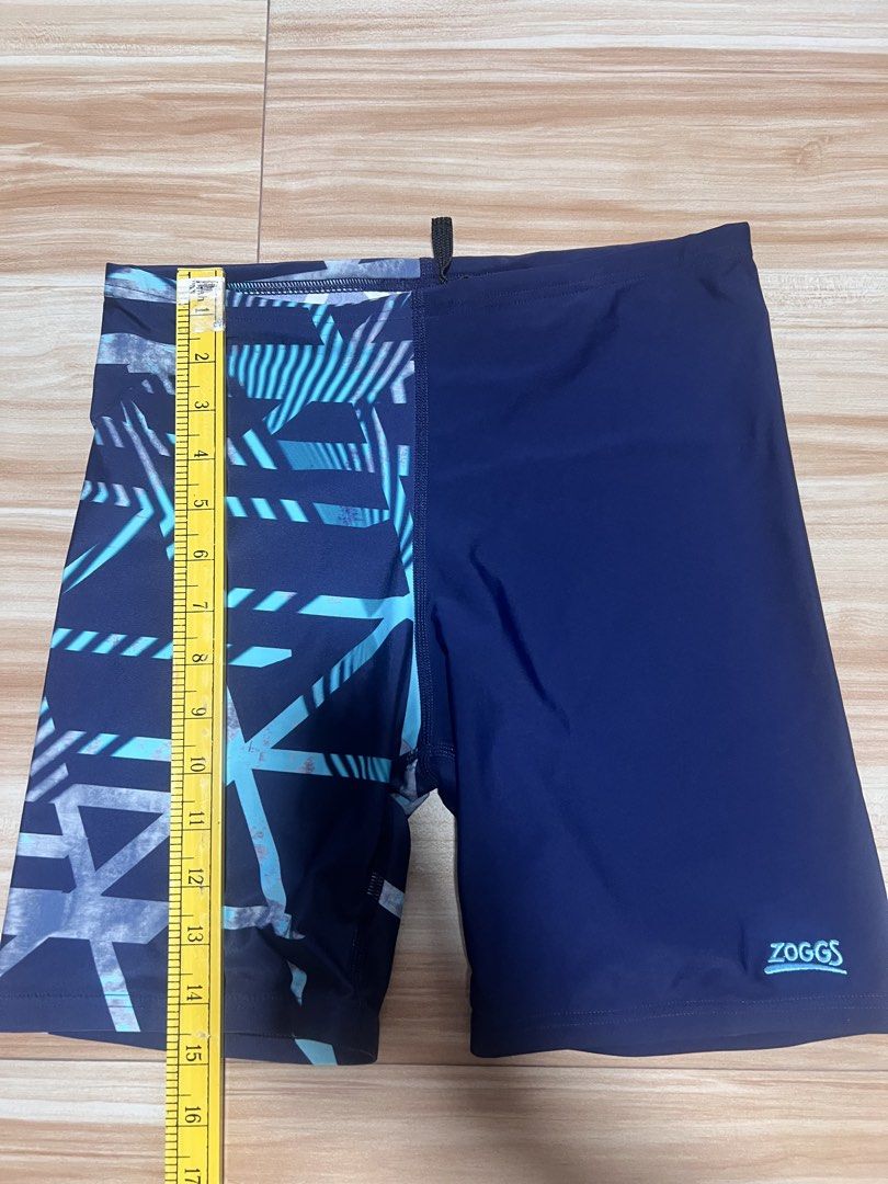 Zoggs Swim Shorts - Size 34 (Category: Swim Trunks & Board Shorts) located in Manila. Submitted by jk2578 (Listing ID 1444176141, Image 3). Description: - Zoggs Ecolast Swim Shorts SIZE 34 - Navy blue with a cool geometric pattern on one leg - Elastic waistband with drawstring for a secure fit - Made with durable Ecolast fabric - Ideal for swimming lessons, beach trips, or just splashing around!.