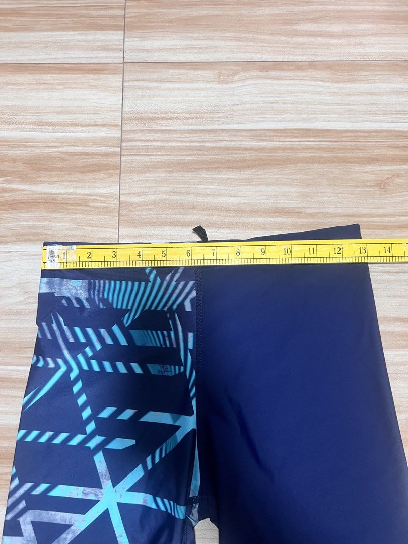 Zoggs Swim Shorts - Size 34 (Category: Swim Trunks & Board Shorts) located in Manila. Submitted by jk2578 (Listing ID 1444176141, Image 2). Description: - Zoggs Ecolast Swim Shorts SIZE 34 - Navy blue with a cool geometric pattern on one leg - Elastic waistband with drawstring for a secure fit - Made with durable Ecolast fabric - Ideal for swimming lessons, beach trips, or just splashing around!.