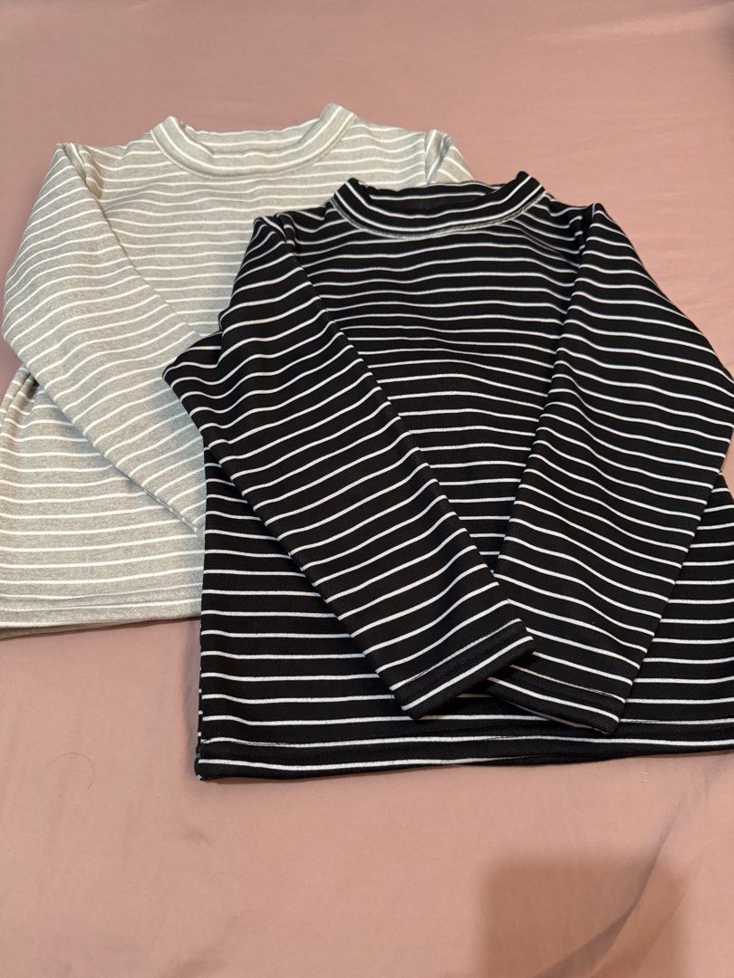 2 Striped Long Sleeve Tops - Black & Grey Size 120 (Category: Babies & Kids Fashion) located in Muntinlupa City. Submitted by thechicknit (Listing ID 1444373102, Image 1). Description: - Two long sleeve tops: 1 black with white stripes, 1 grey with white stripes. - Size 120 - Features a stylish mock neck. - Lined with soft, fuzzy material for ultimate warmth and coziness. - Ideal for cooler weather. - Comfortable and relaxed fit..