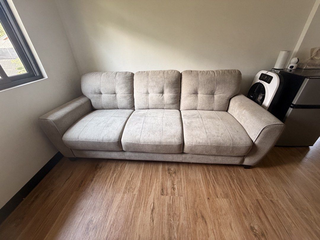 Mandaue 3-Seater gray- Beige Fabric Sofa (Category: Sofas) located in Quezon City. Submitted by r.tp07 (Listing ID 1444471889, Image 1). Description: - Comfortable 3-seater sofa - Neutral beige fabric upholstery - Tufted back cushions for added style - Plush and deep seat cushions for ultimate comfort - Softly padded armrests - Fits well in most living spaces - Ideal for lounging and entertaining guests.