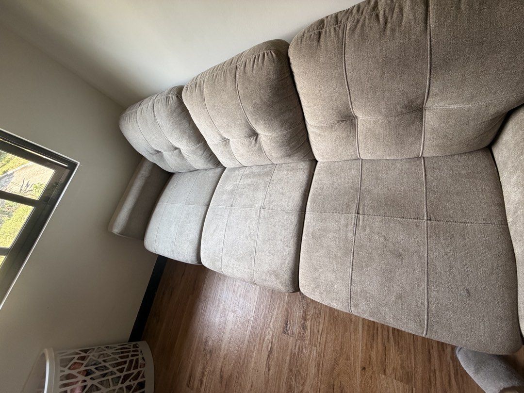 Mandaue 3-Seater gray- Beige Fabric Sofa (Category: Sofas) located in Quezon City. Submitted by r.tp07 (Listing ID 1444471889, Image 2). Description: - Comfortable 3-seater sofa - Neutral beige fabric upholstery - Tufted back cushions for added style - Plush and deep seat cushions for ultimate comfort - Softly padded armrests - Fits well in most living spaces - Ideal for lounging and entertaining guests.
