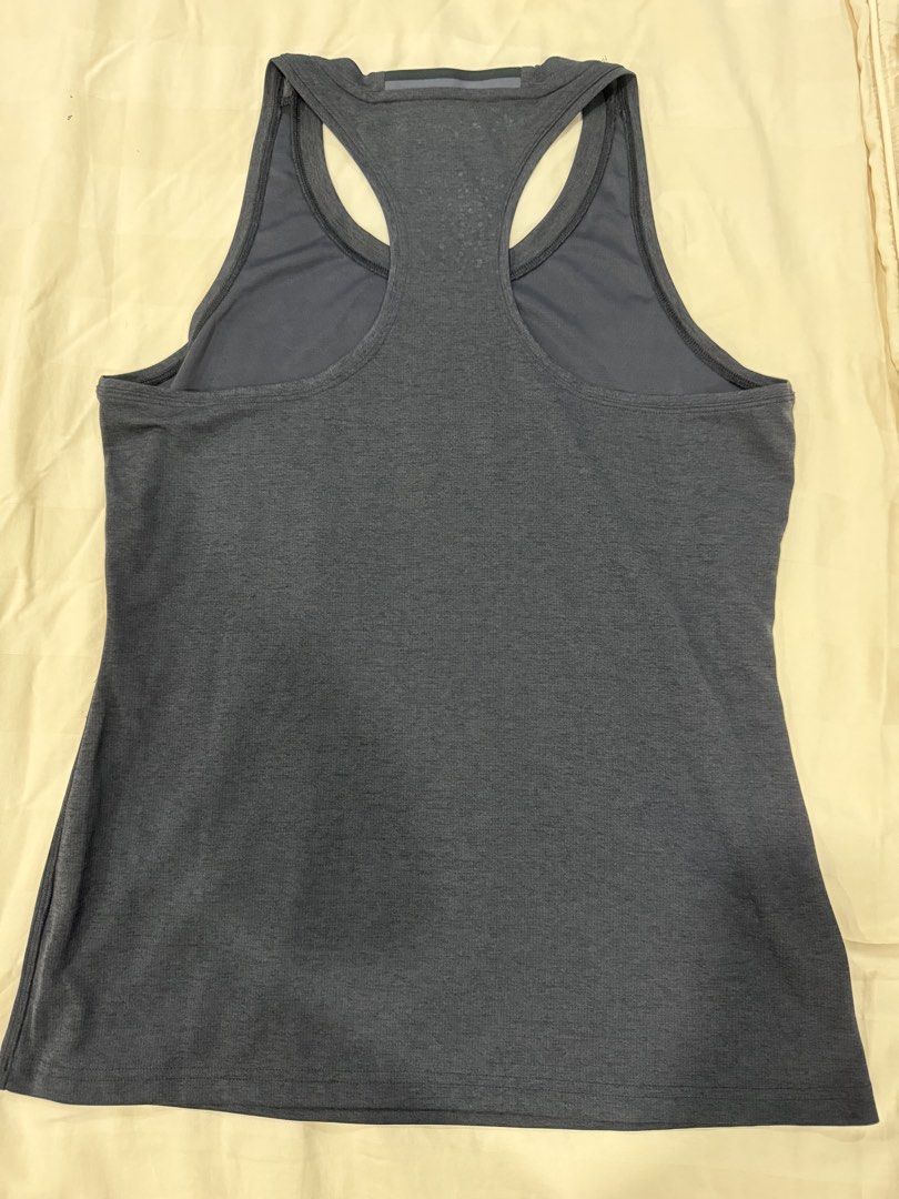 Adidas ClimaChill Racerback Tank Top (Category: Activewear) located in Quezon City. Submitted by jiafoo (Listing ID 1444496062, Image 2). Description: - Adidas ClimaChill tank top - Dark grey heathered fabric - Racerback design - Perforated detail on upper back for enhanced breathability - Lightweight and comfortable material - Perfect for workouts or casual wear.