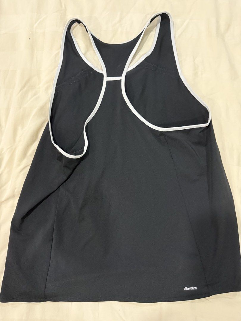 Adidas Climalite Black Tank Top (Category: Activewear) located in Quezon City. Submitted by jiafoo (Listing ID 1444496357, Image 3). Description: - Black Adidas tank top - Racerback style with white trim - Climalite fabric for breathability - Ideal for workouts or casual wear - Size: Medium.
