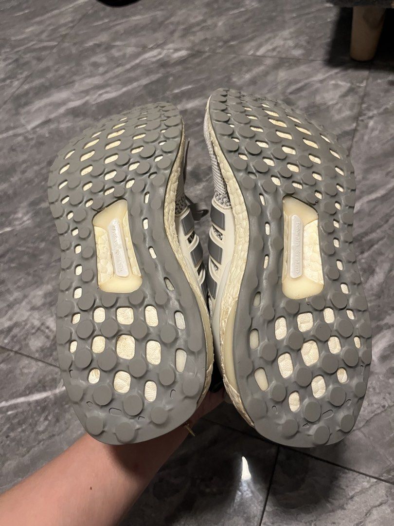 Adidas Ultraboost Running Shoes (Category: Sneakers) located in Makati City. Submitted by GoddessCloset (Listing ID 1444481836, Image 3). Description: - Adidas Ultraboost sneakers - Color: Cream and Grey knit upper - Features classic Boost midsole for comfort and energy return - Ideal for running or everyday casual wear - Shows some signs of wear on soles and uppers, but still has plenty of life left.