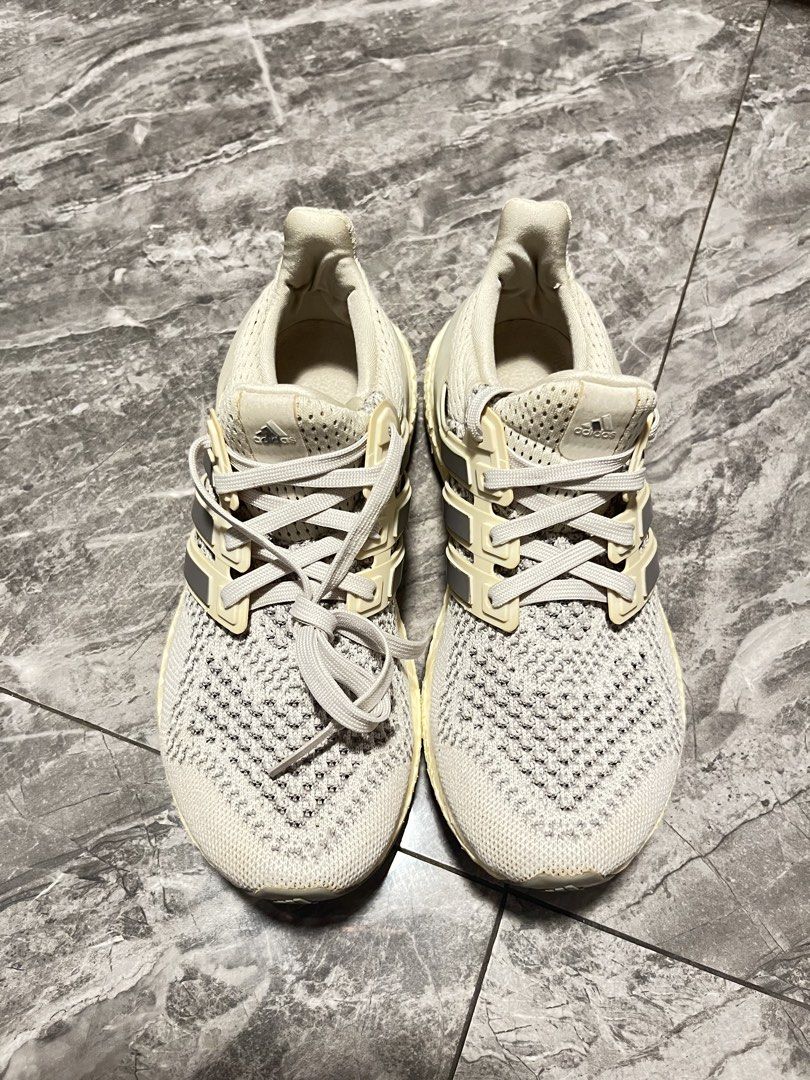 Adidas Ultraboost Running Shoes (Category: Sneakers) located in Makati City. Submitted by GoddessCloset (Listing ID 1444481836, Image 1). Description: - Adidas Ultraboost sneakers - Color: Cream and Grey knit upper - Features classic Boost midsole for comfort and energy return - Ideal for running or everyday casual wear - Shows some signs of wear on soles and uppers, but still has plenty of life left.