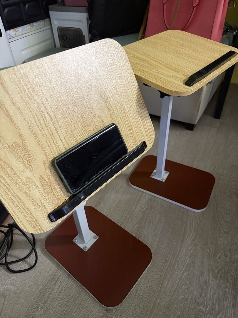 Adjustable Table (Category: Tables & Sets) located in Kuala Lumpur. Submitted by sallyyin6618 (Listing ID 1444333445, Image 1). Description: - Adjustable height for comfortable use - Tiltable top surface to find your perfect angle - Built-in stopper to keep your device secure - Ideal for working from bed or sofa - Easy to move around.