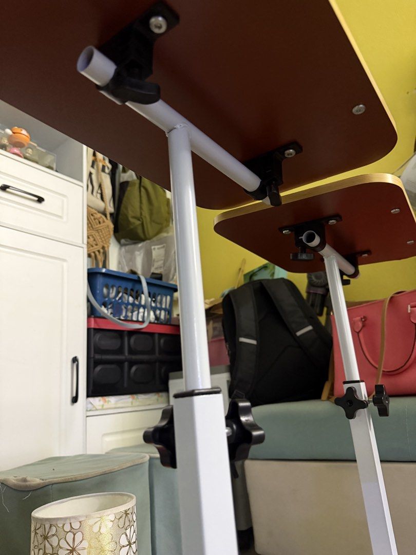 Adjustable Table (Category: Tables & Sets) located in Kuala Lumpur. Submitted by sallyyin6618 (Listing ID 1444333445, Image 3). Description: - Adjustable height for comfortable use - Tiltable top surface to find your perfect angle - Built-in stopper to keep your device secure - Ideal for working from bed or sofa - Easy to move around.