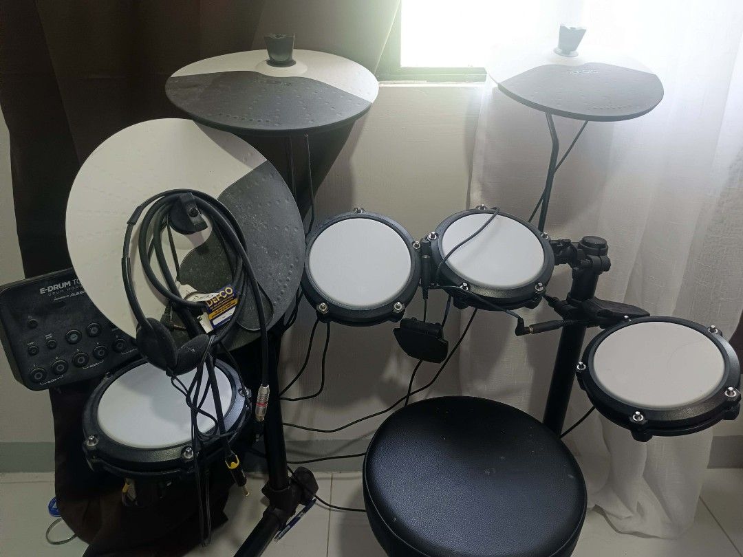 Alesis DM Lite Electronic Drum Kit (Category: Musical Instruments) located in Manila. Submitted by jamech_17 (Listing ID 1444419819, Image 3). Description: - Alesis DM Lite electronic drum kit - Includes drum pads, cymbals, kick pedal, -hat pedal - Comes with drumsticks and headphones - All cables and module are included - Ideal for practice or learning to play - Ready to play right out of the box!.