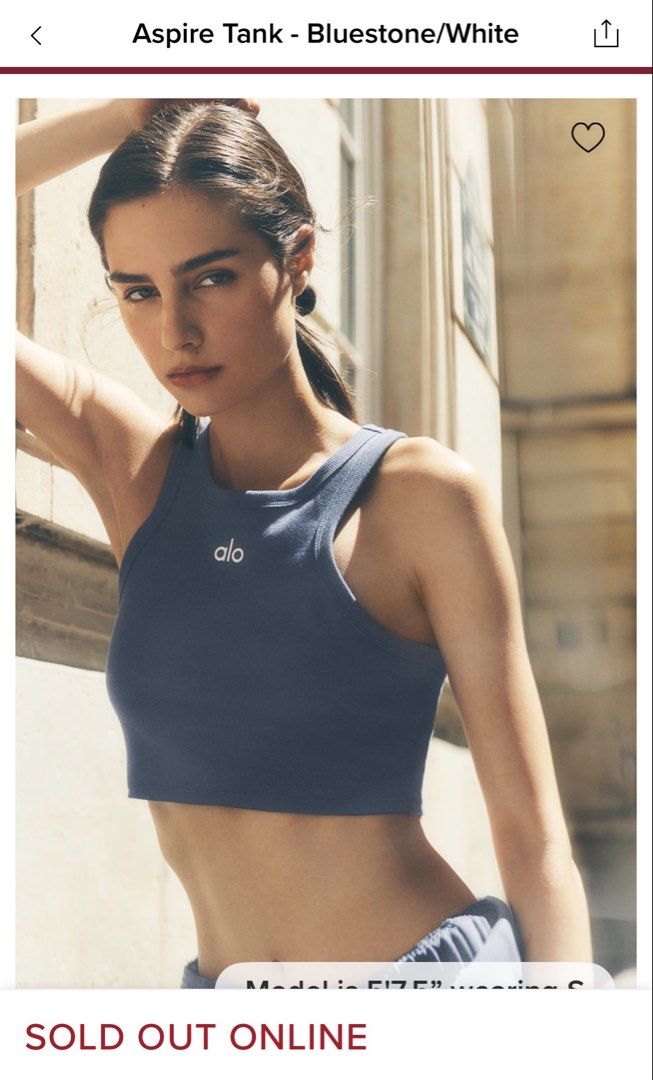 Alo Aspire Tank - Bluestone/White (Category: Activewear) located in Singapore. Submitted by bakeryboys (Listing ID 1444426424, Image 1). Description: - Brand: Alo Yoga - Style: Aspire Tank - Color: Bluestone/White - Features: Ribbed fabric, cropped fit - Versatile: Great for workouts or casual wear Worn once. Hand washed. Price included postage..