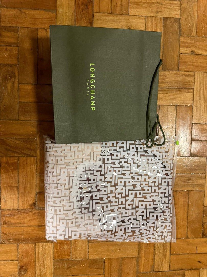 Authentic Longchamp Le Pliage Large (Category: Luxury Bags & Wallets) located in Cebu City. Submitted by redridingroux10 (Listing ID 1444381385, Image 3). Description: - Authentic Longchamp Le Pliage Original Shoulder Bag - Size: L - Color: Light Beige / Paper - Includes: Original dust bag, shopping bag, and clear pouch - Features: Spacious interior, ideal for everyday use or travel RFS: Too big.