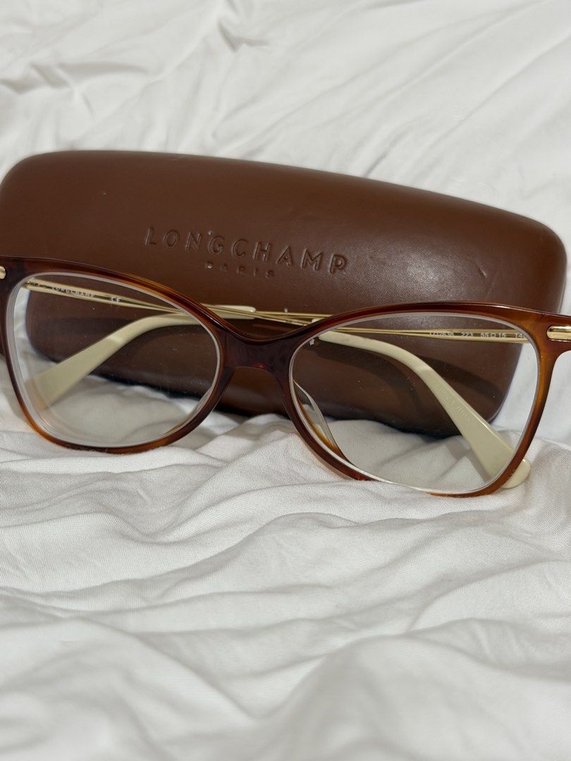 Authentic Longchamp Tortoise Eyeglasses with Original Case (Category: Sunglasses & Eyewear) located in Santa Rosa. Submitted by shi_meilin18 (Listing ID 1444323390, Image 1). Description: Authentic Longchamp Paris eyeglasses LO2636 223 Actual photos are posted Color: Light tortoise with gold Dimension:55-15-140 Lightly used with some scratches but in great condition Bought in the US for around Php 10,000 Selling for Php 3,000 (negotiable) Free J&