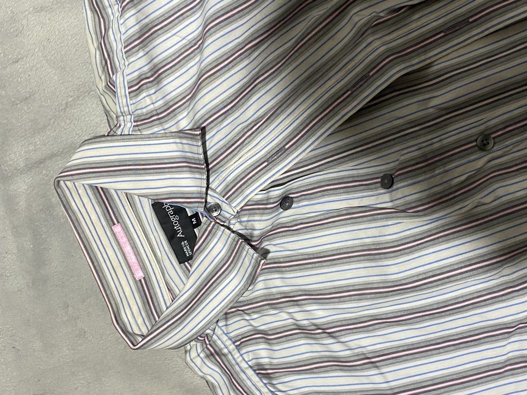 Autograph Striped Long Sleeve Shirt (Category: Tshirts & Polo Shirts ) located in Cavite. Submitted by lana_quinn (Listing ID 1444356729, Image 3). Description: - Classic striped long sleeve shirt from Autograph. - Features a mix of grey, white, blue, and maroon stripes. - Button-up front with a collar. - Subtle pink accent on the inner cuffs. - Size: Medium (M). - Perfect for versatile casual or smart-casual outfits..