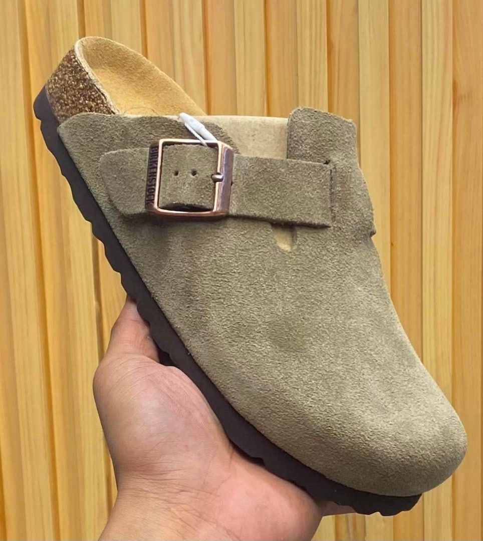 Birkenstock Boston Suede Clogs Taupe (Category: Slippers & Slides) located in Manila. Submitted by santosrich_419 (Listing ID 1444405601, Image 1). Description: - Birkenstock Boston Clogs - Color: Taupe Suede - Features: Classic cork footbed, adjustable strap Availble all sizes - Style: Comfortable and stylish for everyday wear - Convenience: Easy to slip on and off - Ideal for: Birkenstock lovers.