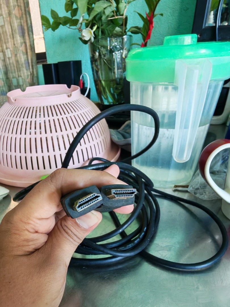 Black HDMI Cable with Gold-Plated Connectors (Category: Cables & Adaptors) located in Carmona. Submitted by tech_hub_cavite (Listing ID 1444385867, Image 3). Description: - Standard black HDMI cable - Connects devices for high-definition video and audio - Gold-plated connectors for improved signal quality - Cable is neatly coiled and ready for use - Tested and works well 5 Meters .