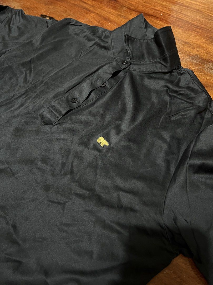 Black Long Sleeve Polo Shirt Size (Category: Coats, Jackets and Outerwear) located in Leyte. Submitted by jcatle (Listing ID 1444367355, Image 2). Description: - Brand: Jack Nicklaus - Color: Black - Style: Long-sleeved polo shirt - Size: 95 - Features: Small embroidered bear logo on chest, button-up neckline - Perfect for: Casual wear or golf.