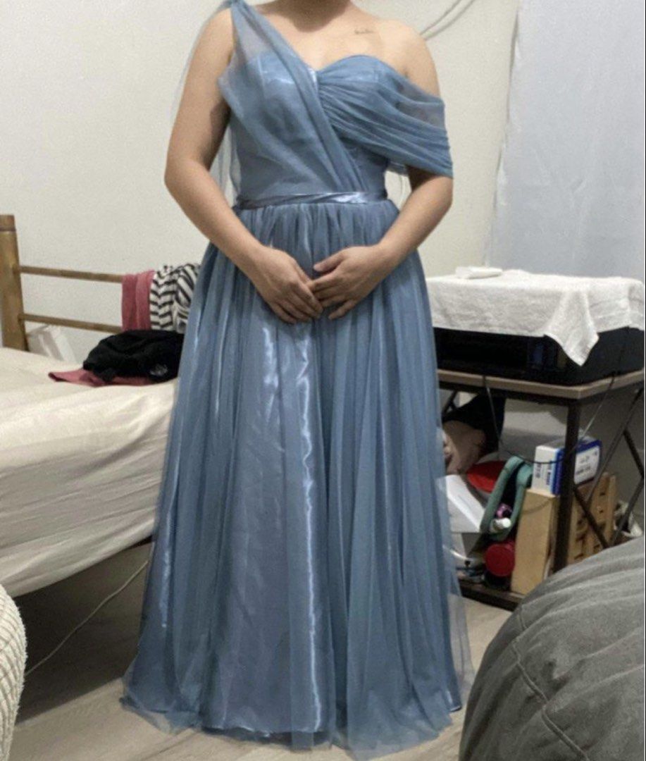 Blue Tulle One-Shoulder Formal Gown (Category: Evening dresses & gowns) located in Quezon City. Submitted by lavl00 (Listing ID 1444434806, Image 1). Description: - Beautiful blue tulle gown - Elegant one-shoulder design with draped detailing - Adjustable lace-up back closure - Floor-length with a flowing skirt - Ideal for formal events or as a bridesmaid dress - Worn only once for a wedding.