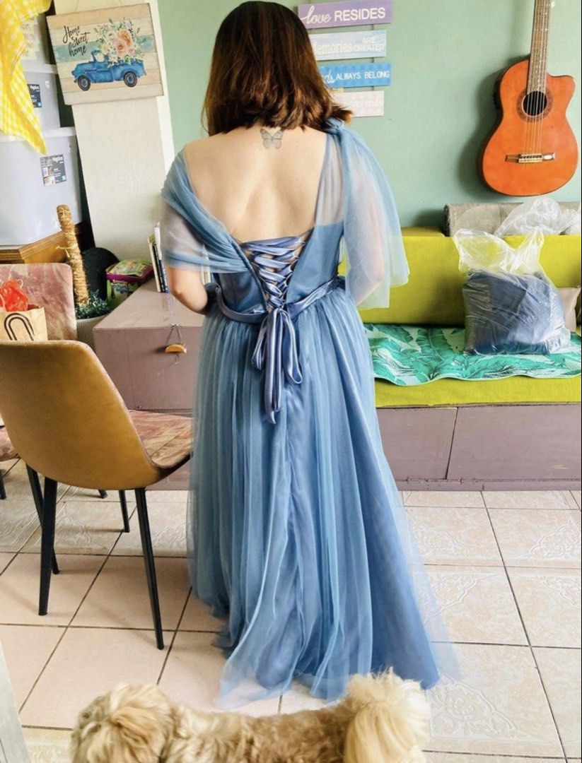 Blue Tulle One-Shoulder Formal Gown (Category: Evening dresses & gowns) located in Quezon City. Submitted by lavl00 (Listing ID 1444434806, Image 3). Description: - Beautiful blue tulle gown - Elegant one-shoulder design with draped detailing - Adjustable lace-up back closure - Floor-length with a flowing skirt - Ideal for formal events or as a bridesmaid dress - Worn only once for a wedding.