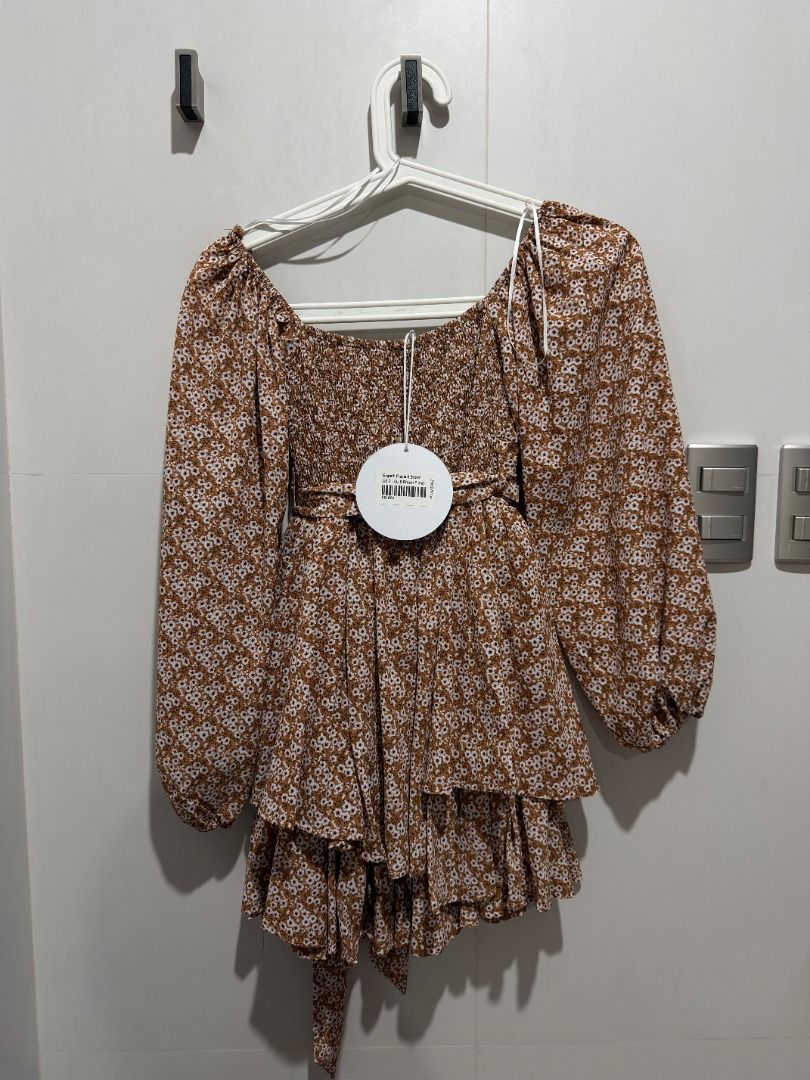 BNEW Princess Polly Brown Floral Romper (Category: Longsleeves) located in Mandaluyong City. Submitted by kayechx (Listing ID 1444403103, Image 3). Description: - BRAND NEW WITH TAGS - Features a square neckline - Long puff sleeves - Tiered ruffled hem - Adjustable tie detail at the waist - Super cute and flowy design - Perfect for dressing up or down - can give 10% discount if you buy more than 3 items from me.