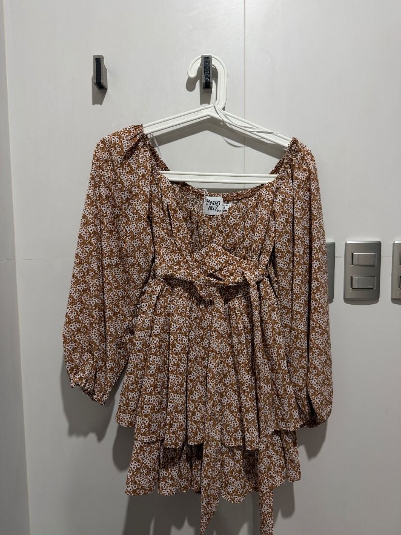 BNEW Princess Polly Brown Floral Romper (Category: Longsleeves) located in Mandaluyong City. Submitted by kayechx (Listing ID 1444403103, Image 1). Description: - BRAND NEW WITH TAGS - Features a square neckline - Long puff sleeves - Tiered ruffled hem - Adjustable tie detail at the waist - Super cute and flowy design - Perfect for dressing up or down - can give 10% discount if you buy more than 3 items from me.