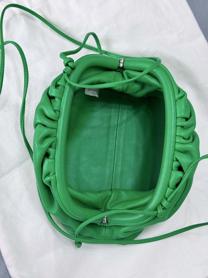 Bottega Veneta mini pouch (Category: Luxury Bags & Wallets) located in Makati City. Submitted by nmvs1 (Listing ID 1444430798, Image 3). Description: Authentic Bottega Veneta pouch bag Color: parakeetGreen - Includes: Dust bag, box, authenticity card With sling crossbody or as a pouch Super great condition.