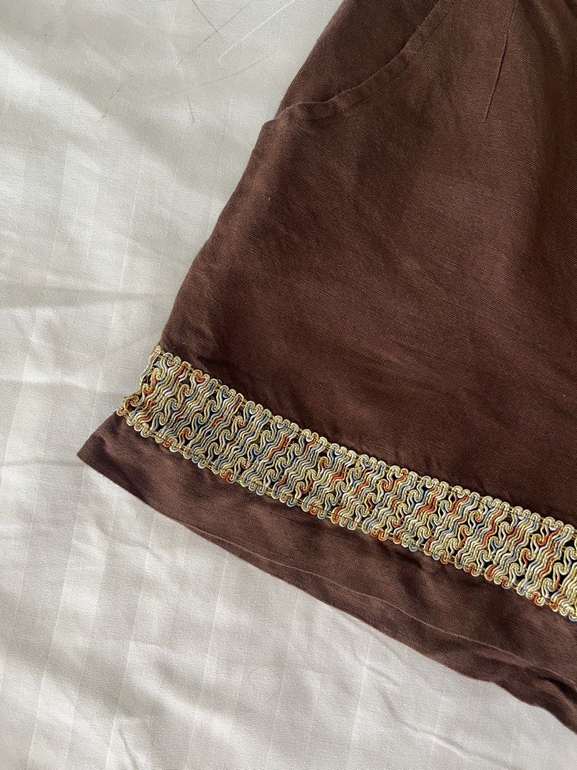 Brown Linen Shorts with Decorative Trim (Category: Shorts) located in Makati City. Submitted by augustrushh (Listing ID 1444429009, Image 2). Description: - Stylish brown linen shorts - Decorative trim along the hem - Two functional side pockets - Secure button and zip closure Waist: 27 in Length: 14.5 in.