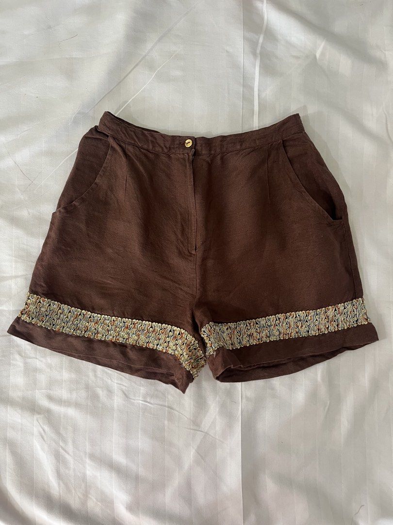 Brown Linen Shorts with Decorative Trim (Category: Shorts) located in Makati City. Submitted by augustrushh (Listing ID 1444429009, Image 1). Description: - Stylish brown linen shorts - Decorative trim along the hem - Two functional side pockets - Secure button and zip closure Waist: 27 in Length: 14.5 in.