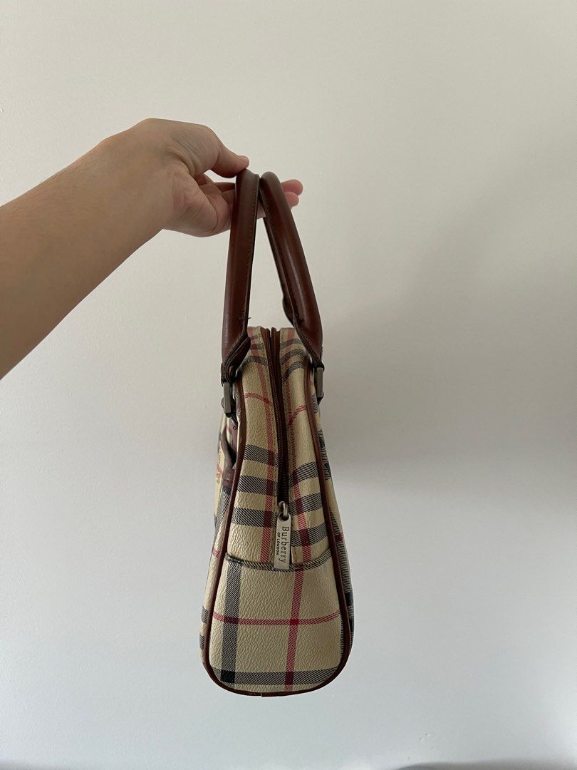 Burberry Blue Label Plaid Boston Bag (Category: Luxury Bags & Wallets) located in Lipa City. Submitted by alysjunk (Listing ID 1444356428, Image 2). Description: - Classic Burberry Blue Label Boston Bag - Iconic plaid pattern with equestrian knight details - Genuine leather trim and handles - Interior zippered pocket - Stylish and practical for everyday wear.
