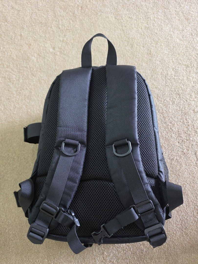 Camera Backpack (Category: Camera Bags & Carriers) located in Singapore. Submitted by sapfo (Listing ID 1444248624, Image 3). Description: - Stylish black camera backpack with eye-catching red accents. - Multiple zippered compartments to keep your camera and accessories organized. - Made from durable fabric for long-lasting use. - Top-attached straps for comfortable carrying. - Perfect for storing and transporting your camera staff..