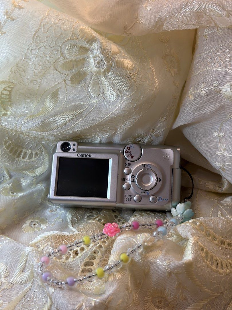 Canon PowerShot A460 Digital Camera 5.0 Megapixels 4x Optical Zoom (Category: Cameras) located in Davao. Submitted by ennalyf (Listing ID 1444460044, Image 2). Description: - Canon PowerShot A460 Digital Camera - 5.0 Megapixels for clear photos - 4x Optical Zoom to get closer - Comes with a cute beaded strap - Tested and confirmed working - Ideal for casual, everyday photography - Ready for its new owner! Issue - Line output only.