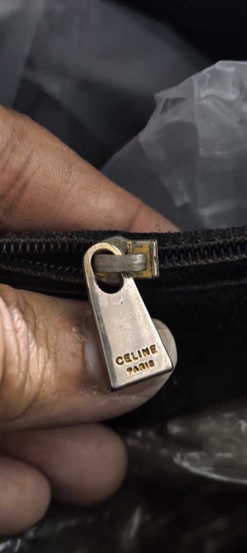 VINTAGE Celine Macadam Canvas Tote Bag (Category: Luxury Bags & Wallets) located in Cagayan de Oro. Submitted by tommygurl1218 (Listing ID 1444415793, Image 2). Description: - Authentic Vintage Celine Tote Bag - Iconic Macadam Print - Genuine Leather Trim and Handles - Secure Zipper Closure - Gold Tone Hardware - Interior Tag: "DM97/2 MADE IN ITALY" - Noteworthy: Minor signs of wear on zipper pull and leather, consistent with vintage condition. W