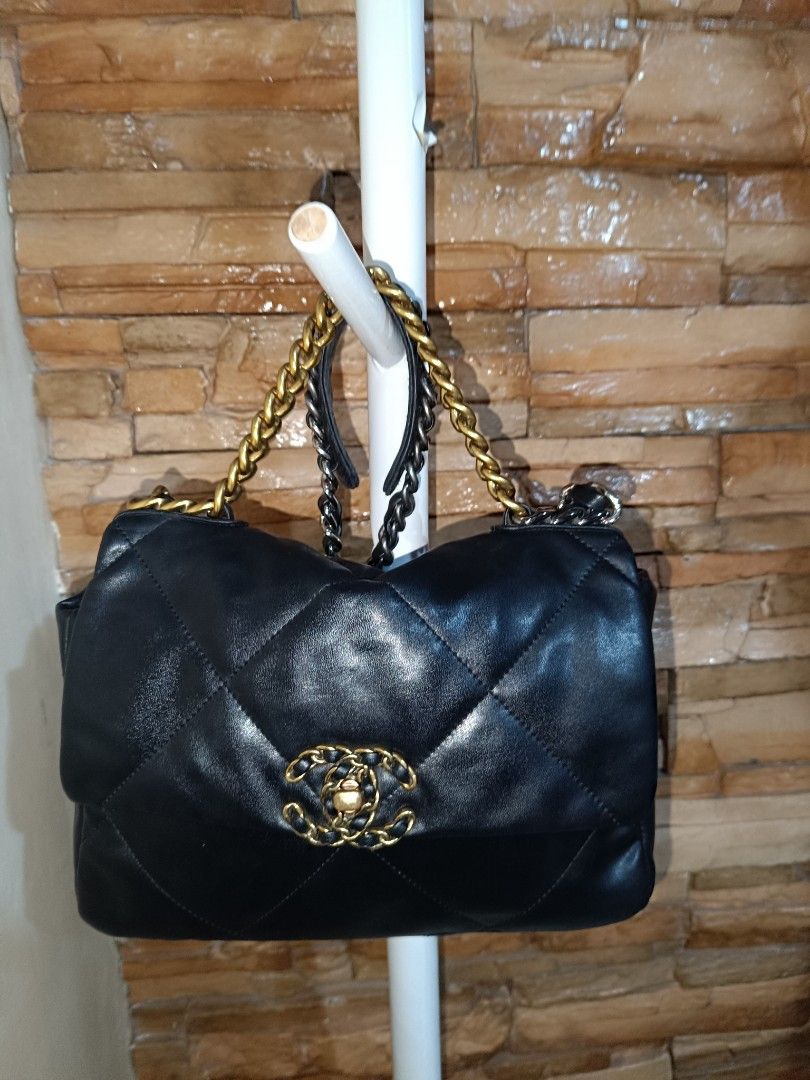 Chanel 19 Black Leather Flap Bag with code (Category: Luxury Bags & Wallets) located in Antipolo. Submitted by secondmusebags (Listing ID 1444484260, Image 3). Description: Negotiable Condition: Good as new Code has tear - with code - Black leather flap bag - Diamond quilting detail - Gold and silver chain strap - Iconic Chanel logo on front closure - Spacious interior - Perfect for day or night use.