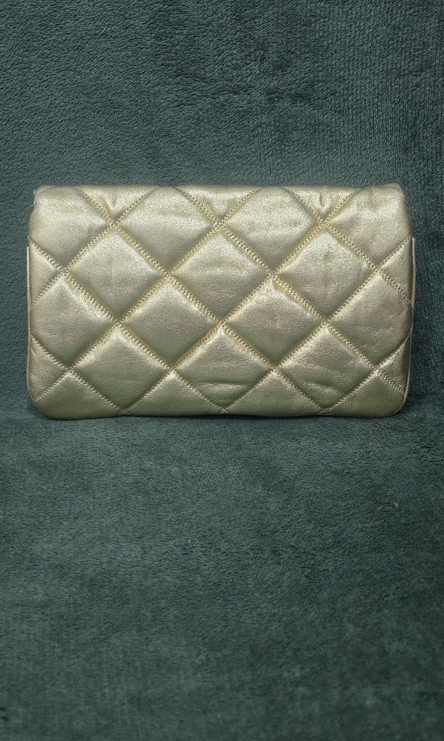 Chanel Flap Clutch in Gold (Category: Luxury Bags & Wallets) located in Bacoor. Submitted by deux_trading_corporation (Listing ID 1444426862, Image 2). Description: 145k and above on 2ndhand market. condition: Rank A - looks unused. payment first. you can always ask for discount/tawad but no to sobrang barat. no reservation. always check all the photos. some photo/s indicate the flaw..