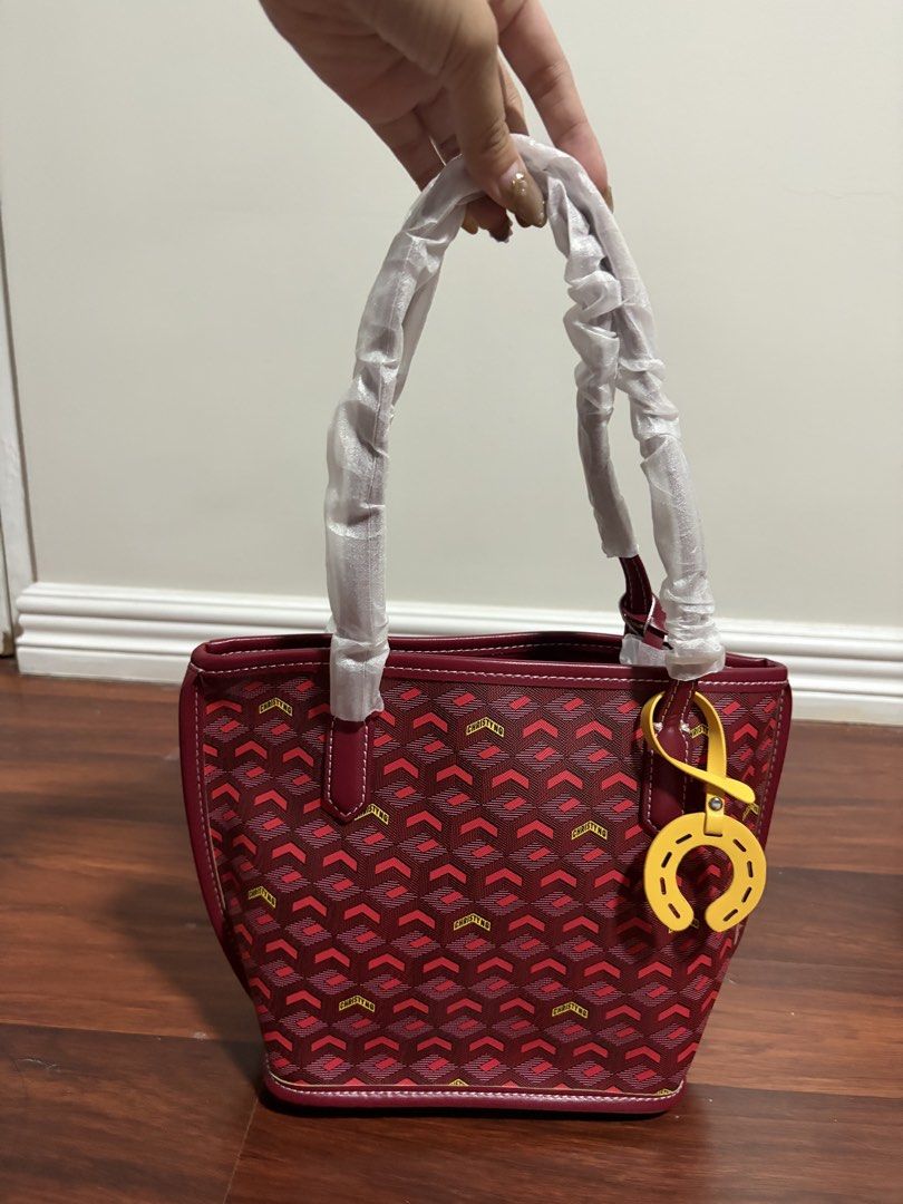 Christy Ng Red Monogram Tote Bag with Pouch (Category: Tote Bags) located in Valenzuela. Submitted by pencakes_ (Listing ID 1444434502, Image 3). Description: red mini tote bag from christy ng comes with a matching pouch includes a horse shoe charm gifted to me, never been used rfs - decluttering shipping fee will be shouldered by the buyer:).