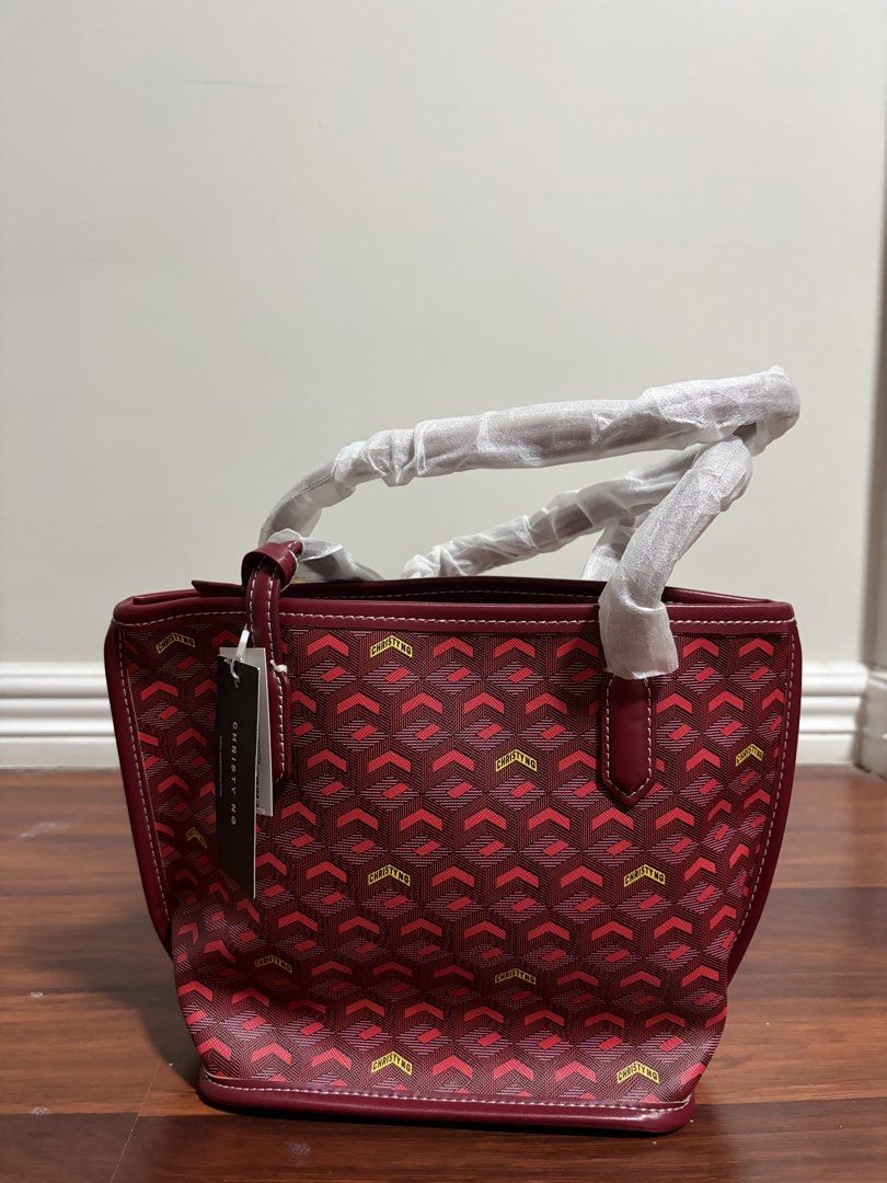 Christy Ng Red Monogram Tote Bag with Pouch (Category: Tote Bags) located in Valenzuela. Submitted by pencakes_ (Listing ID 1444434502, Image 1). Description: red mini tote bag from christy ng comes with a matching pouch includes a horse shoe charm gifted to me, never been used rfs - decluttering shipping fee will be shouldered by the buyer:).