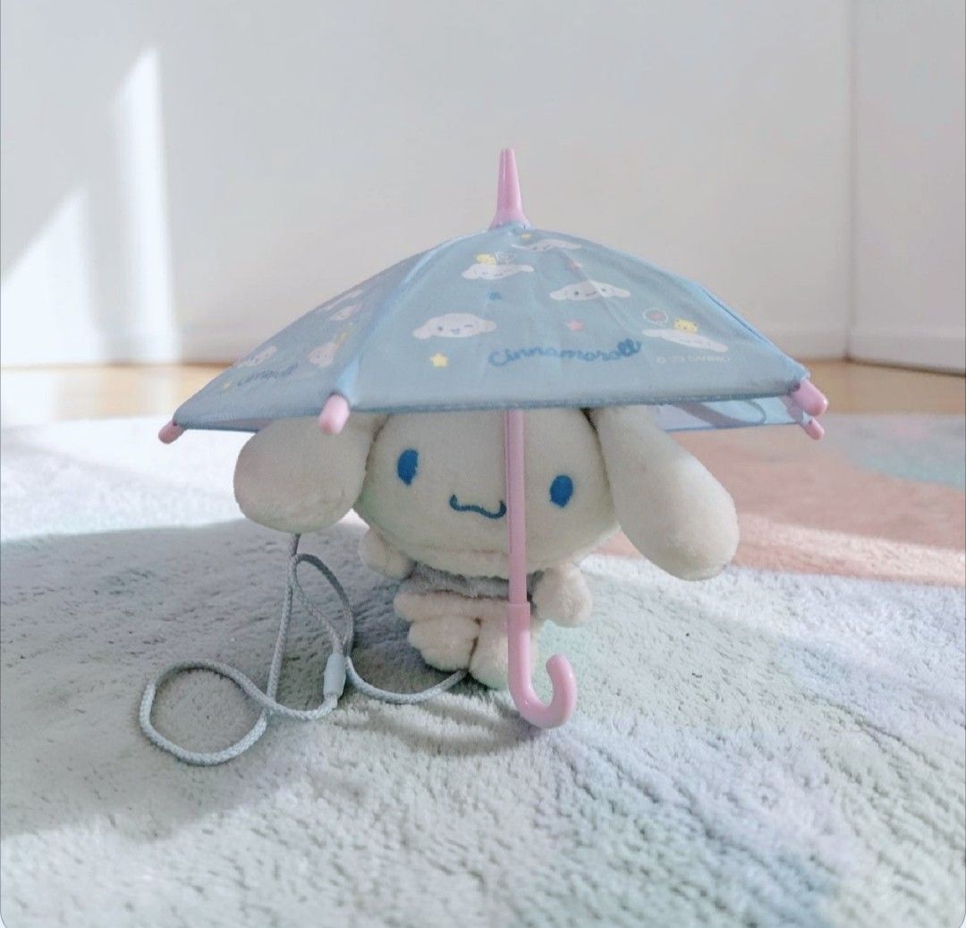 Cinnamoroll coin bag and umbrella (Category: Character Goods) located in Bacoor. Submitted by Exedriae (Listing ID 1444431304, Image 1). Description: coin bag- 450 umbrella-300 if Bundle- 550.