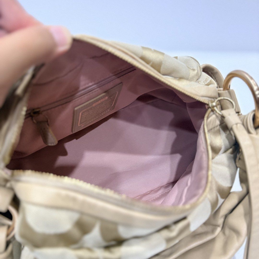 Coach Parker op-art Shoulder Bag (Category: Luxury Bags & Wallets) located in Paranaque City. Submitted by missb1001 (Listing ID 1444469794, Image 3). Description: Coach Parker Op-Art Shoulder bag Overall Condition: 10/10 Canvas body: 10/10 Gold Hardware: 10/10 Rank SA- in excellent condition Dimensions: 12in L x 7in H x 6in D With provided generic dust bag .