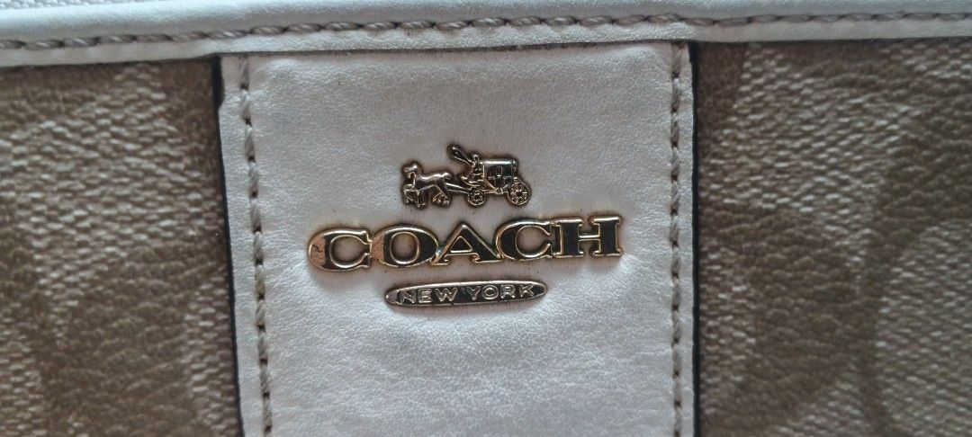 Coach Signature Zip Around Wallet (Category: Wallets & Card holders) located in Dasmarinas. Submitted by MVB0505 (Listing ID 1444335989, Image 2). Description: - Coach Zip Around Wallet - Signature C pattern in tan and cream...CLEAN INSIDE AND OUT bought in japan...malinis parang bago.