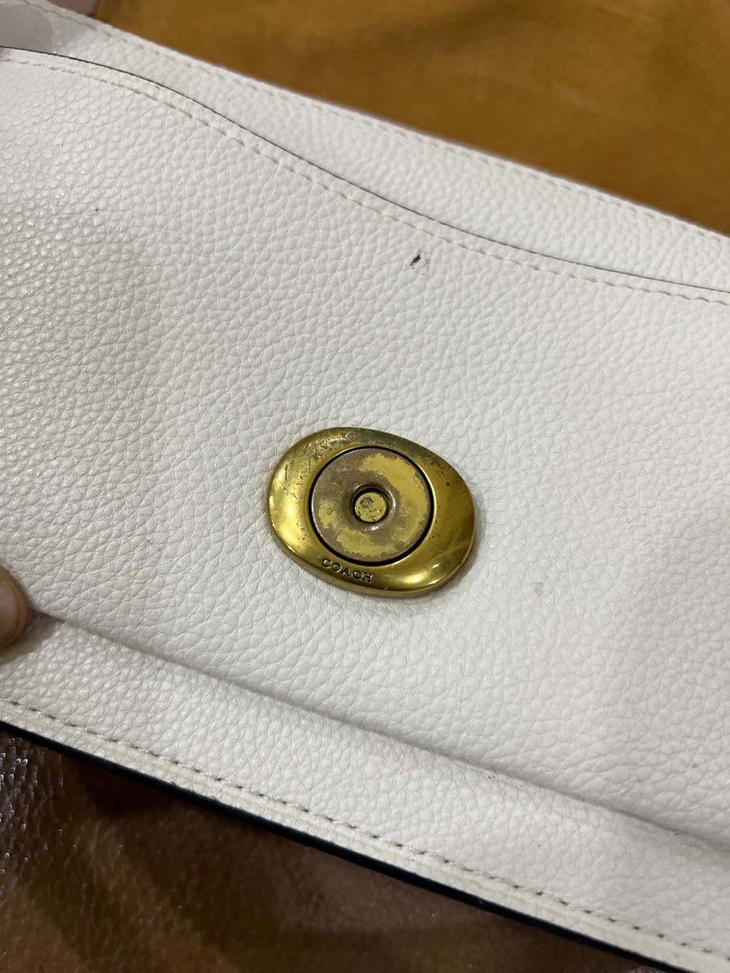 Coach Tabby Shoulder Bag 26 White Pebble Leather (Category: Luxury Bags & Wallets) located in Bacolod City. Submitted by novymaesel14868 (Listing ID 1444418090, Image 2). Description: - White pebble leather Coach bag - Gold iconic C hardware - Secure turn-lock closure - Adjustable strap for comfort - Includes original Coach hangtag - Versatile for daily use or special events - Interior is clean and well-maintained.