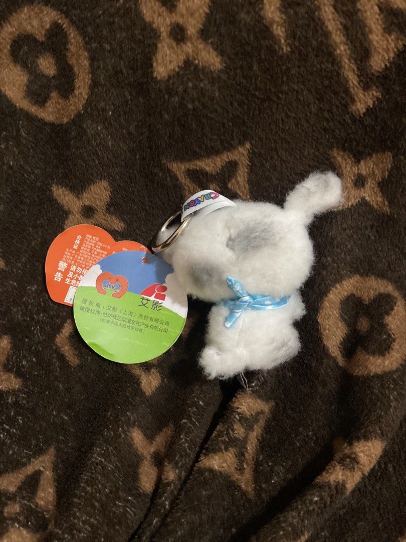 Crayon Shin-chan White Dog Plush Keychain (Category: Plushies & Soft Toys) located in Paranaque City. Submitted by eller_2 (Listing ID 1444489313, Image 3). Description: Shin-chan white dog plush keychain with blue ribbon, heart tag, and keyring. Perfect for bags and keys!.